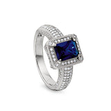 Platinum finish sterling silver micropave emerald cut synthetic blue sapphire ring with simulated diamonds