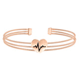 Rose Gold Finish Sterling Silver Three Cable Cuff Bracelet With A Polished Heart With A Heartbeat Design.